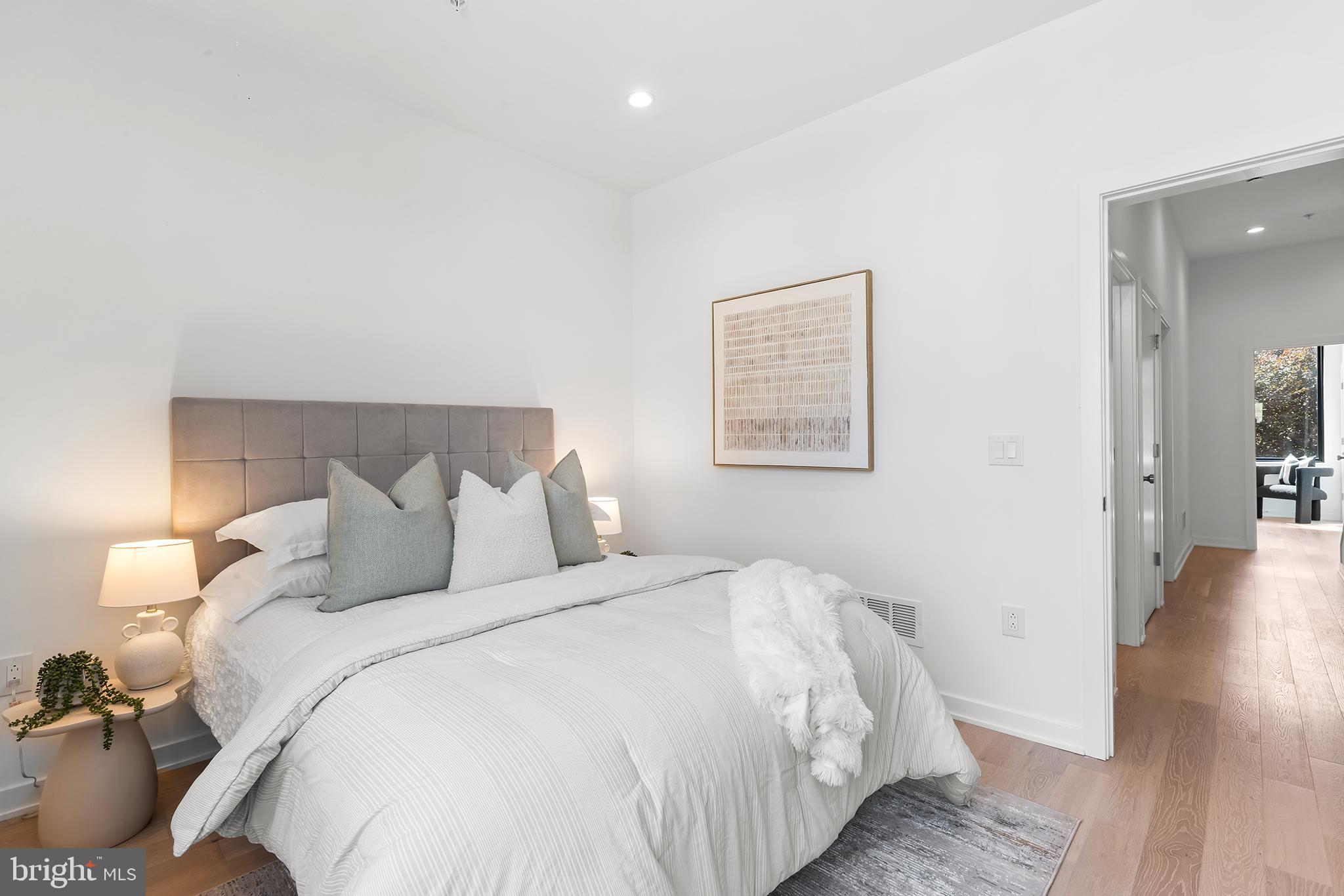 259 Delmar Street Philadelphia, PA 19128 - Photo 19 of 30 a bedroom with bed and wooden floor