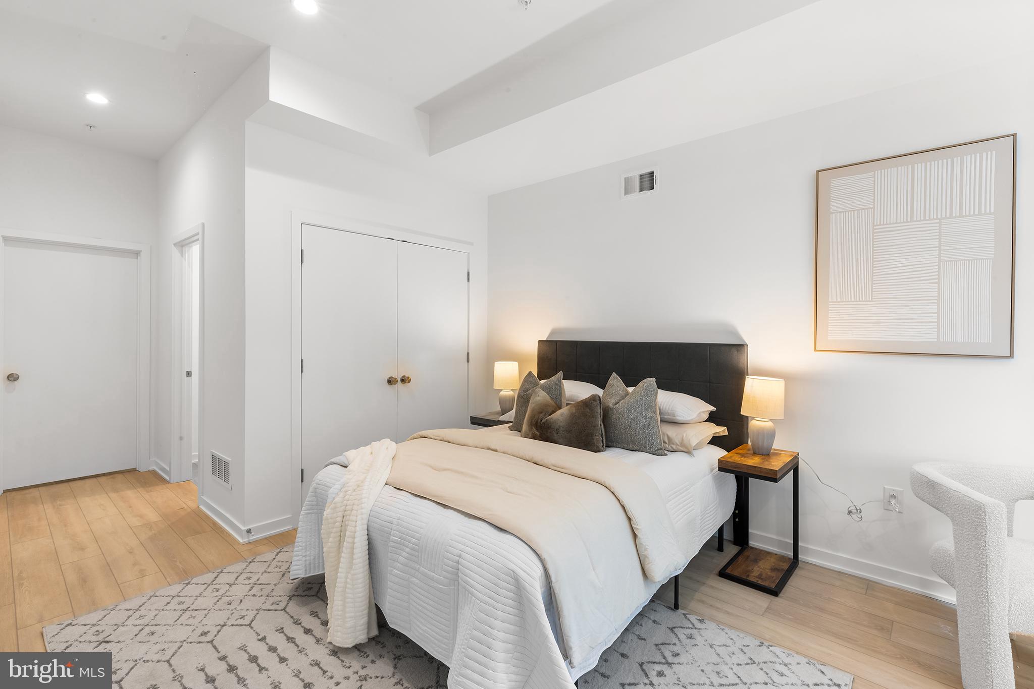 259 Delmar Street Philadelphia, PA 19128 - Photo 21 of 30 a bedroom with a bed and a painting on the wall