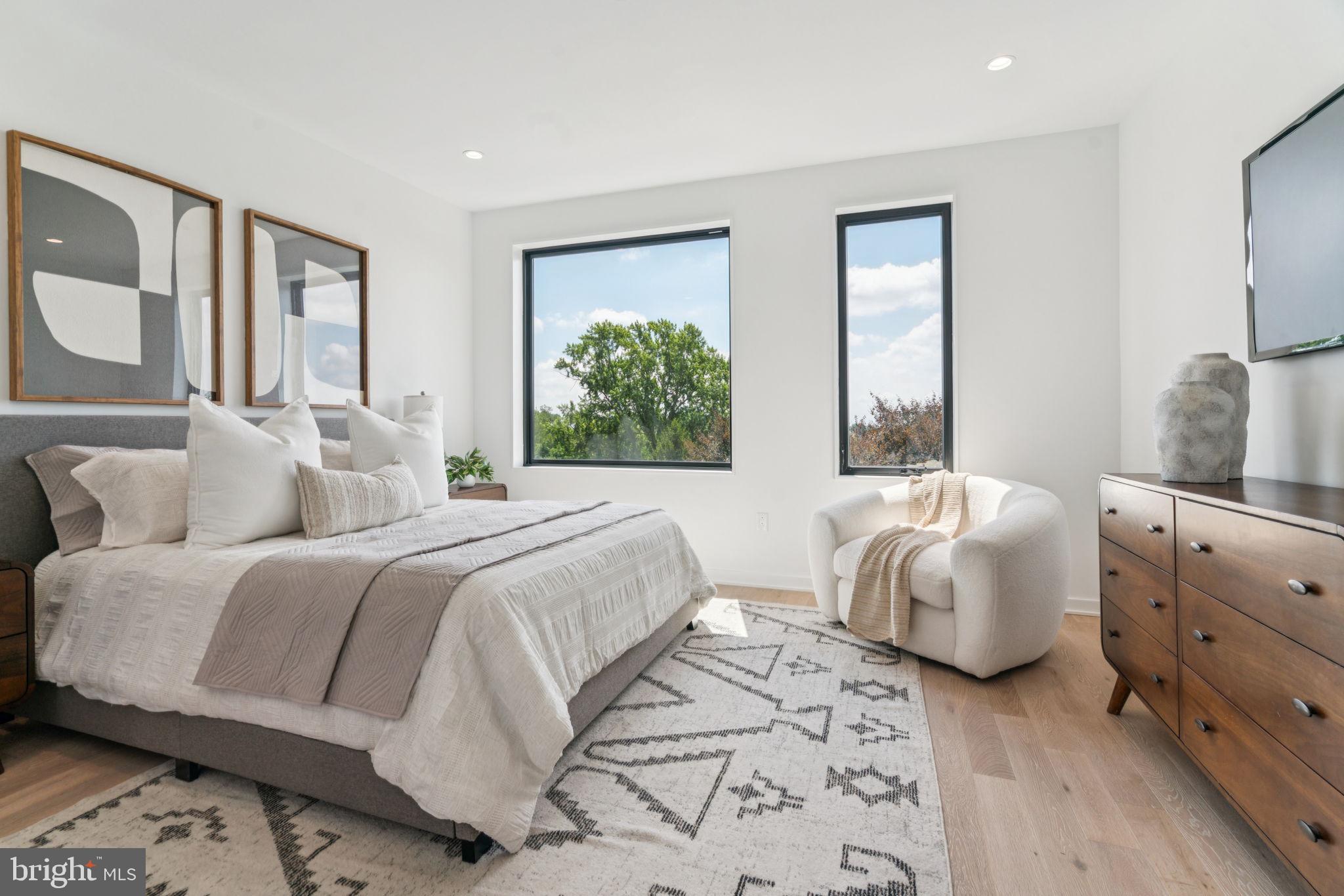 259 Delmar Street Philadelphia, PA 19128 - Photo 8 of 30 a bedroom with a bed and a large window