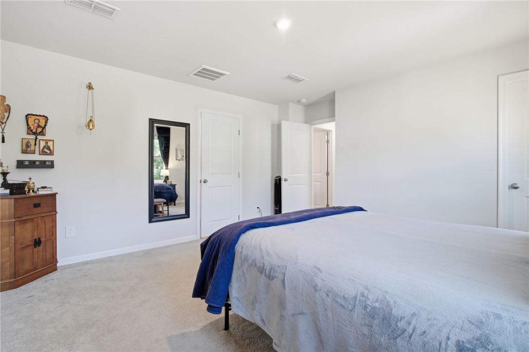 112 Wls Sta Road Seneca, SC 29678 - Photo 22 of 42 Plush carpeting underfoot and smooth walls define this comfortable, light-filled bedroom retreat.