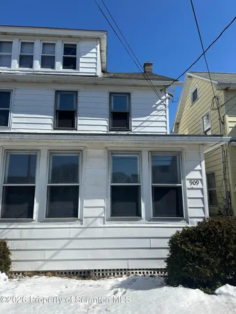 a view of a house with a window and balcony