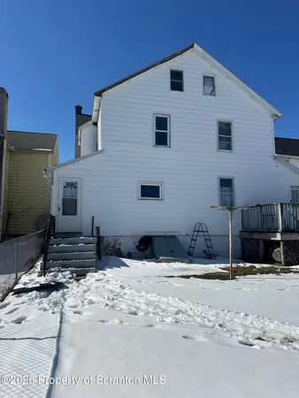 a view of two house with a yard