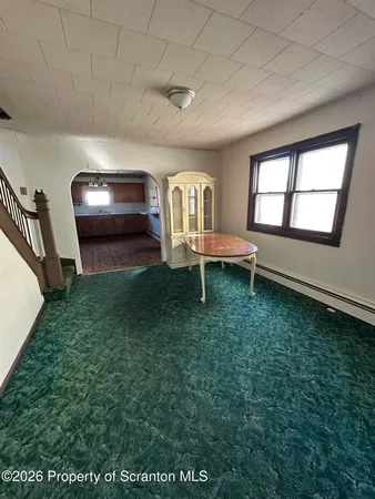 a view of a livingroom with furniture and a fireplace