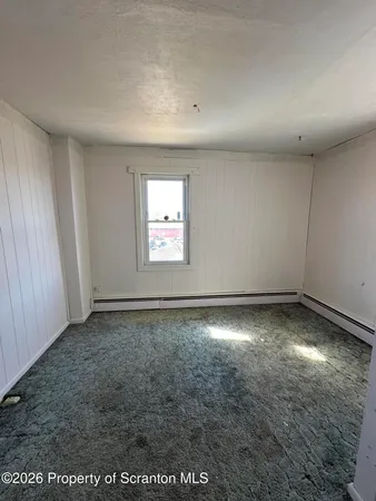 an empty room with a natural light