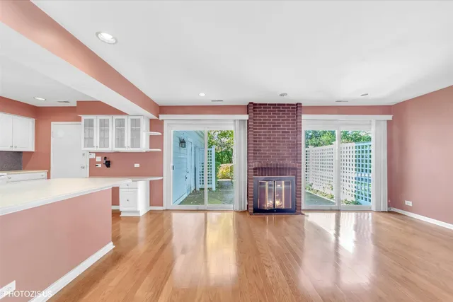 a large hall with a large window and wooden floor