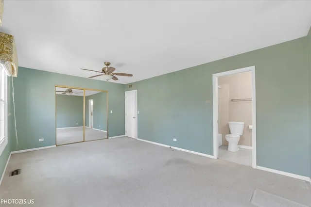 a view of an empty room with a bathroom