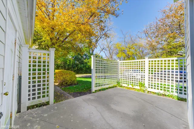 a view of a wooden fence and trees