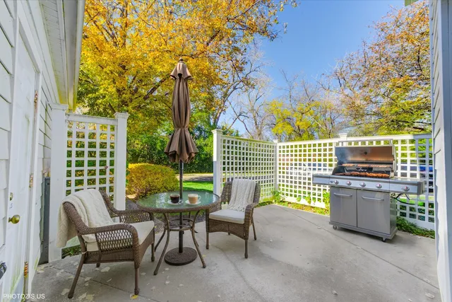 a view of a chairs and table in a patio
