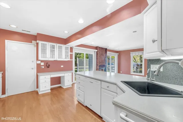 a kitchen with stainless steel appliances a sink and a refrigerator