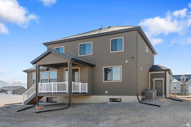 562 West Coyote Rdg Road Grantsville, UT 84029 - Photo 4 of 27 Contemporary residence with a covered patio featuring white railings