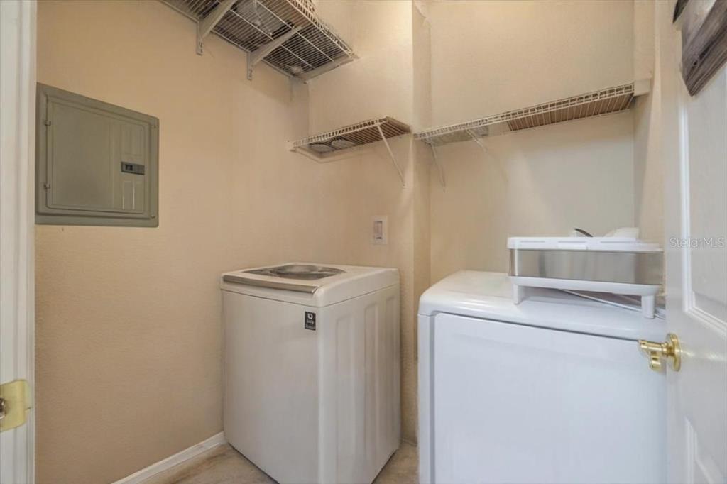 830 Airport Road, Unit 111 Port Orange, FL 32128 - Photo 15 of 21 a utility room with dryer and washer