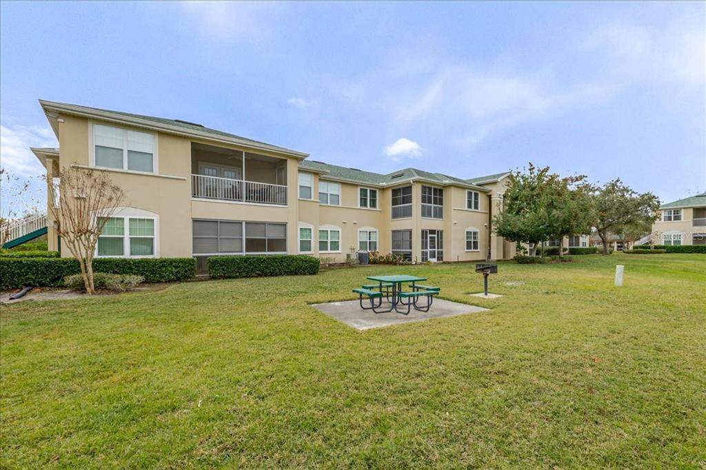 830 Airport Road, Unit 111 Port Orange, FL 32128 - Photo 17 of 21 a front view of a house with garden