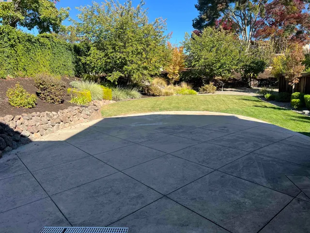 a backyard of a house with lots of green space