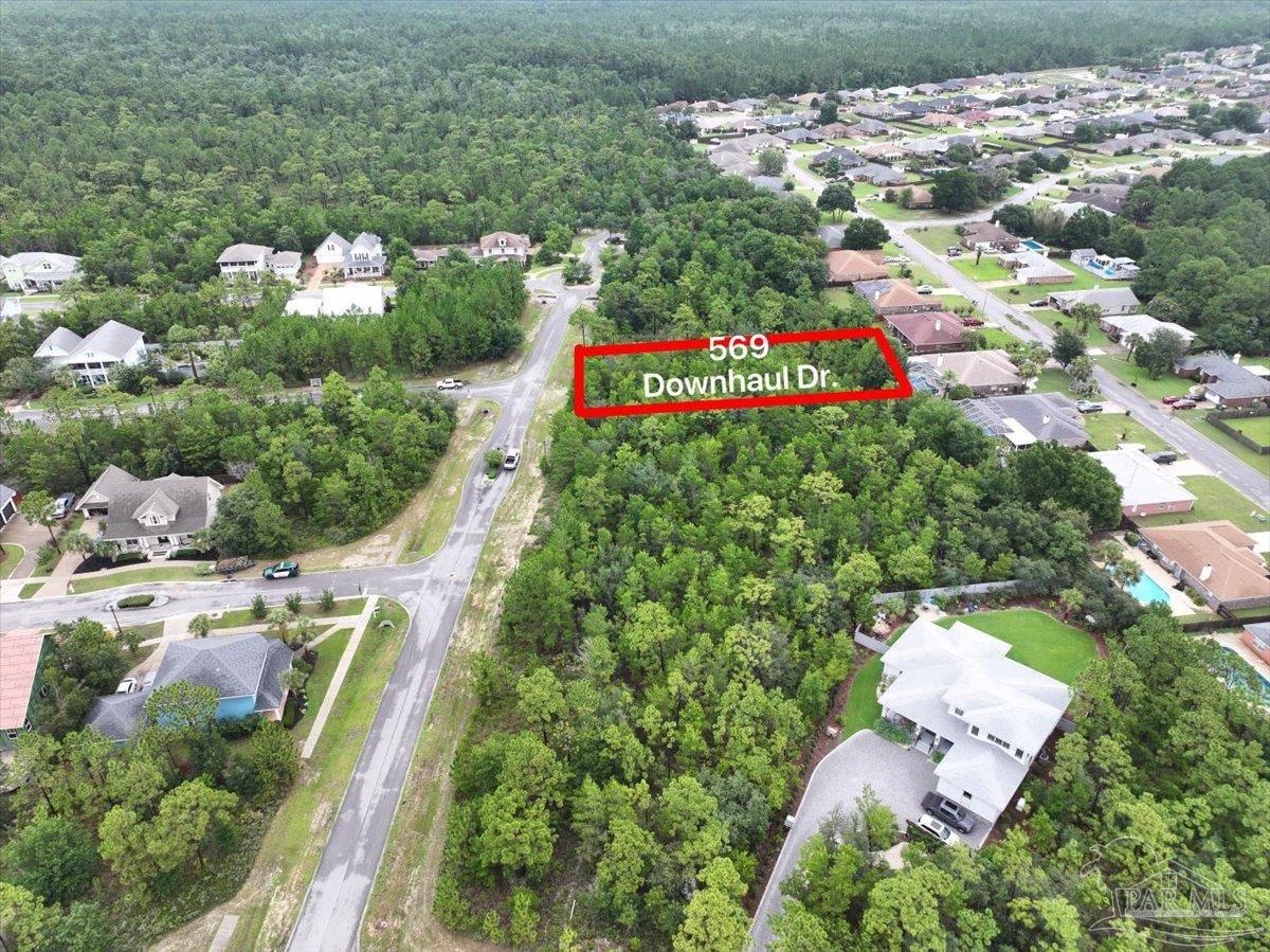 569 Downhaul Drive Pensacola, FL 32507 - Photo 11 of 13 an aerial view of swimming pool outdoor seating and yard