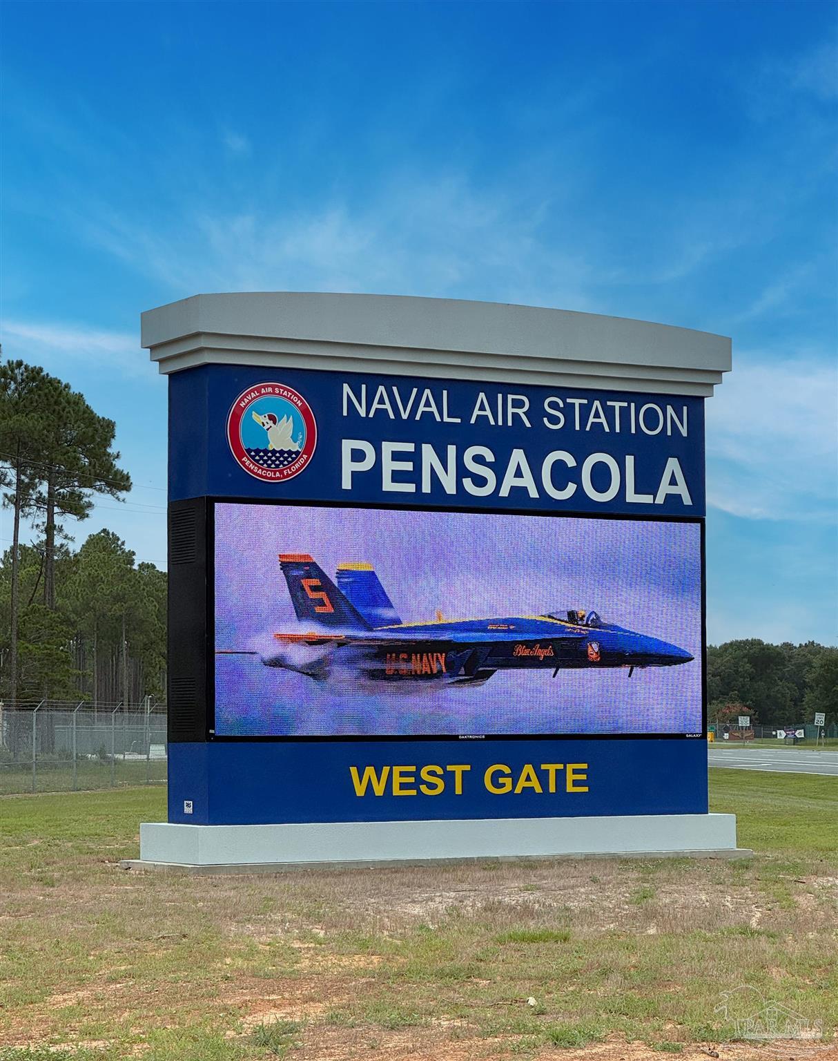 569 Downhaul Drive Pensacola, FL 32507 - Photo 12 of 13 a sign that is sitting on the wooden wall