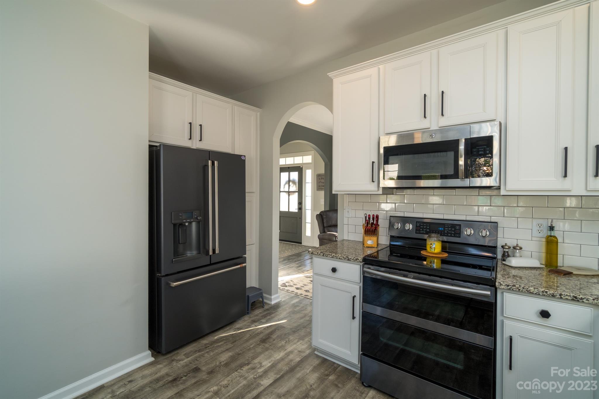 3375 Merchant Lane Davidson, NC 28036 - Photo 11 of 29 a kitchen with a refrigerator stove and microwave