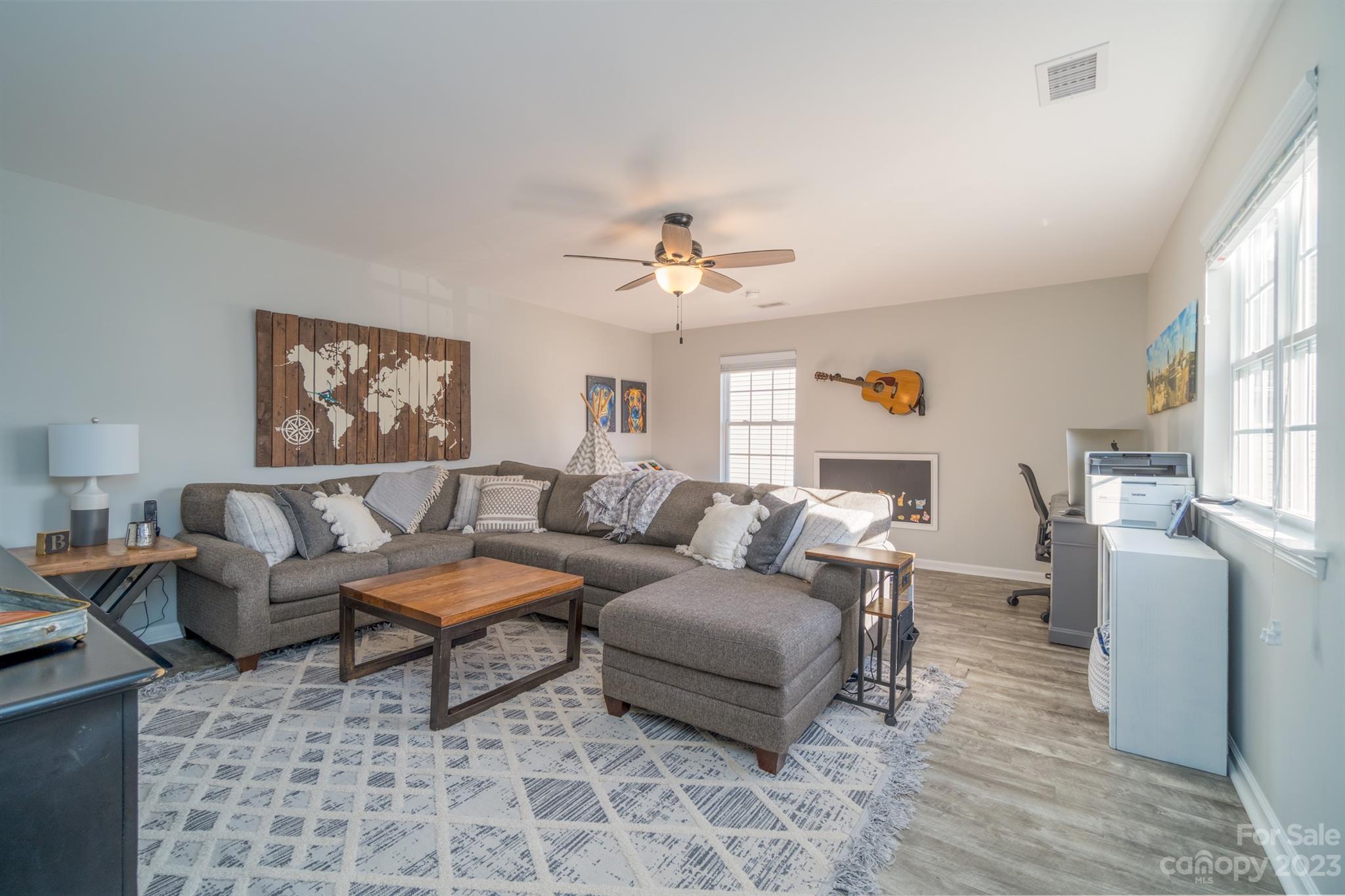 3375 Merchant Lane Davidson, NC 28036 - Photo 17 of 29 a living room with furniture and a chandelier