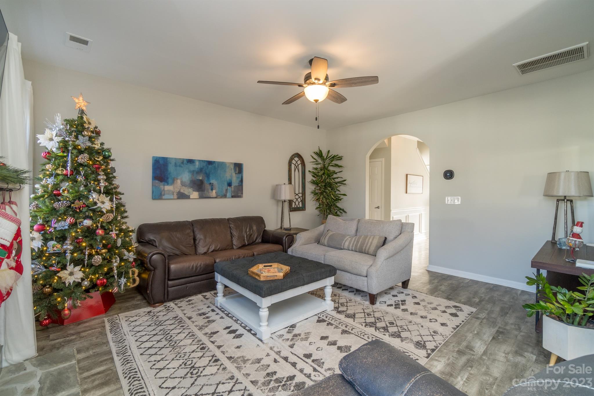 3375 Merchant Lane Davidson, NC 28036 - Photo 7 of 29 a living room with furniture and a potted plant