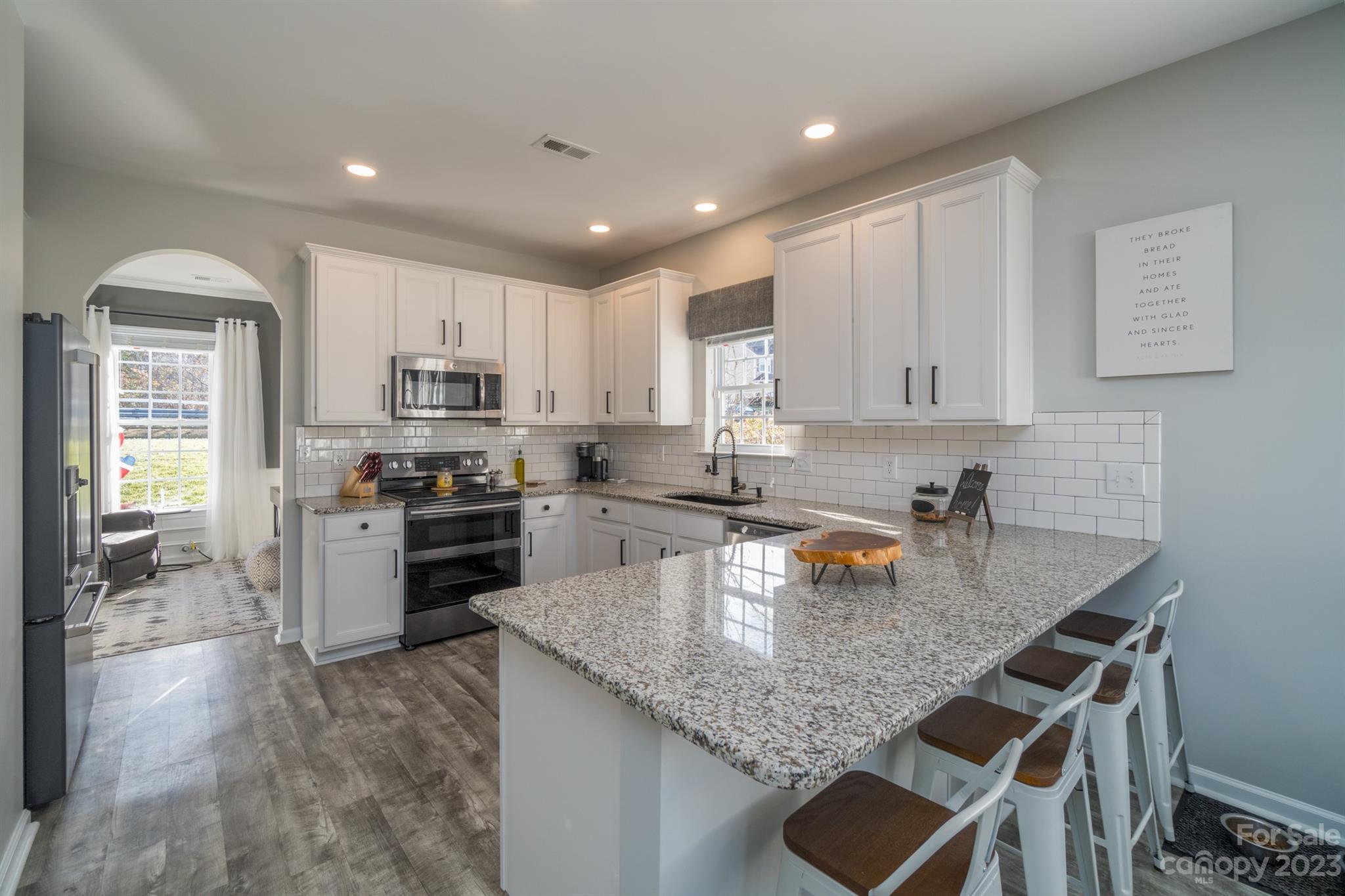 3375 Merchant Lane Davidson, NC 28036 - Photo 10 of 29 a kitchen with a stove sink microwave and refrigerator