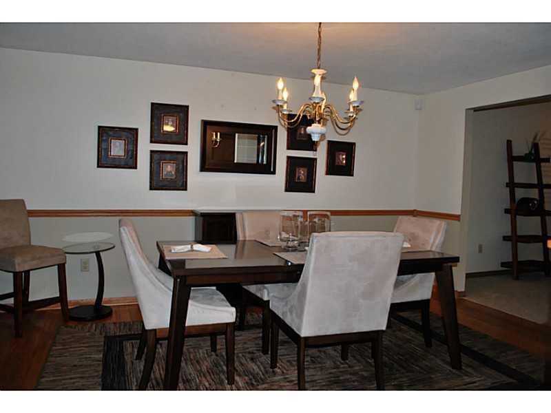 296 Sun Mine Road Sarver, PA 16055 - Photo 5 of 25 Dining Room. Dining Room open to Living Room and Kitchen has Hardwood Floor and Chair Rail