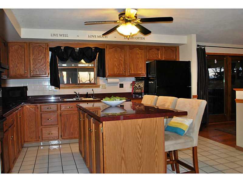 296 Sun Mine Road Sarver, PA 16055 - Photo 7 of 25 Kitchen. Large Center Island Kitchen with Ceramic Tile Floor, Lighted Ceiling Fan, Gas Cook Top, Refrigerator, Microwave, Dishwasher, Oven