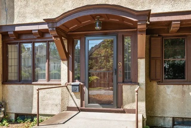 a front view of a house with a glass door