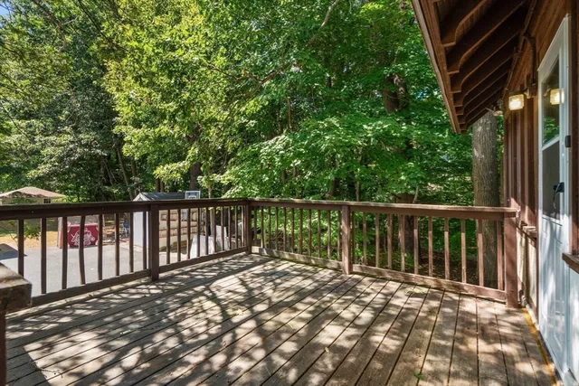 a view of balcony with wooden floor