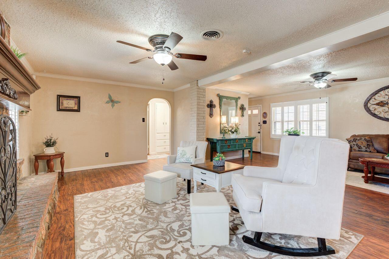4904 18th Street Lubbock, TX 79416 - Photo 14 of 39 a living room with furniture and wooden floor