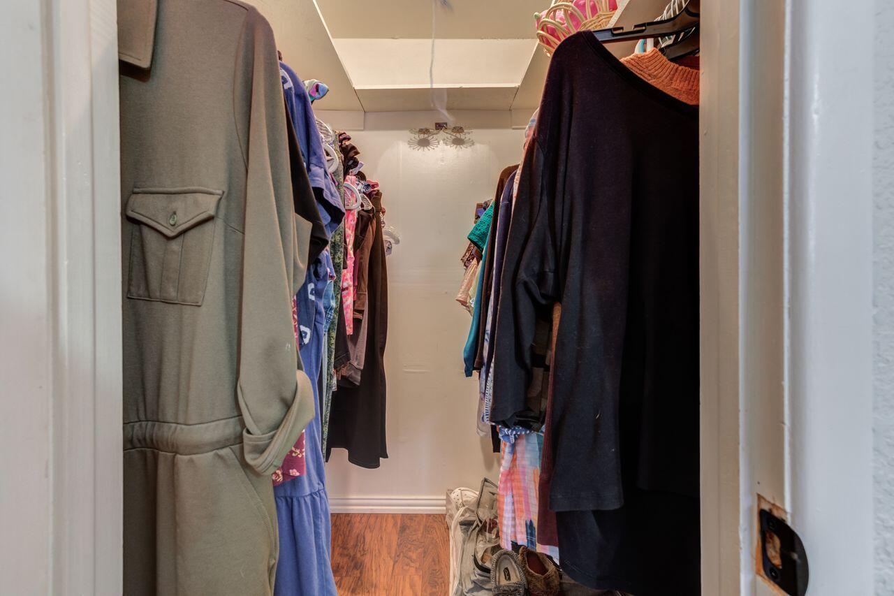 4904 18th Street Lubbock, TX 79416 - Photo 34 of 39 a view of walk in closet with clothes and shoes