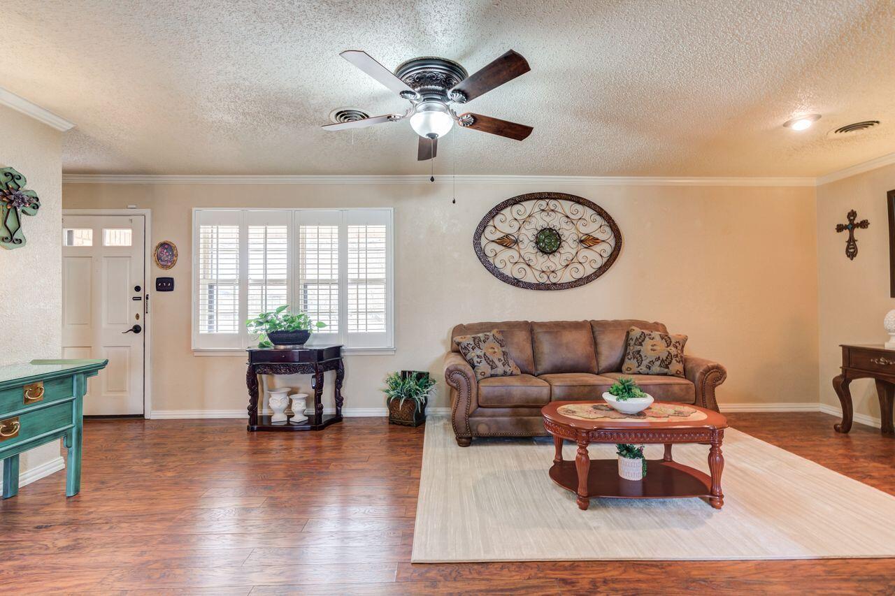 4904 18th Street Lubbock, TX 79416 - Photo 7 of 39 a living room with furniture and a large window