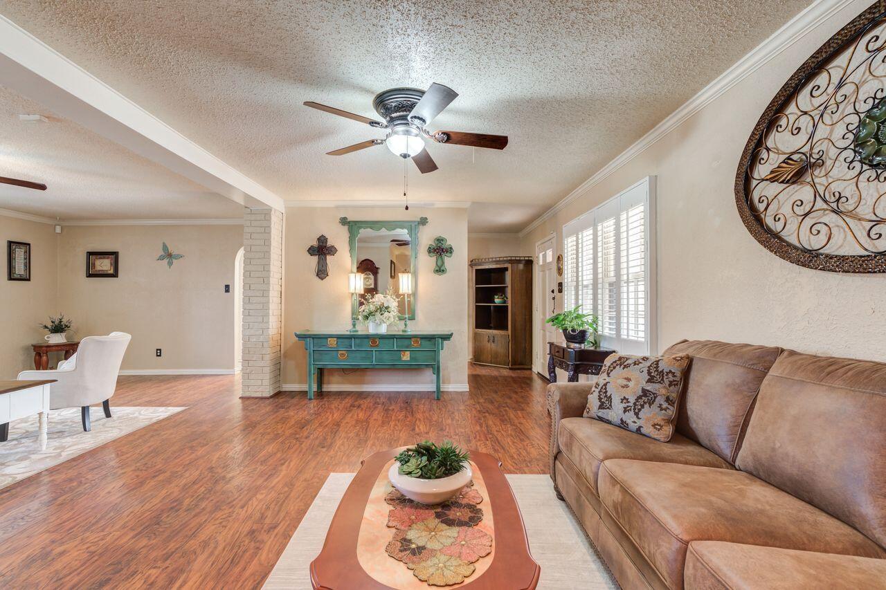 4904 18th Street Lubbock, TX 79416 - Photo 8 of 39 a living room with furniture and a wooden floor