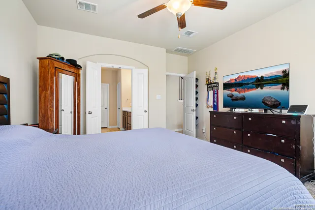 a spacious bathroom with a double vanity sink mirror and double