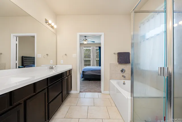 a view of a hallway with entryway and stairs