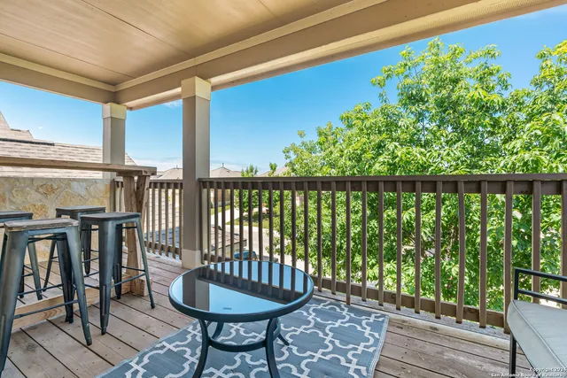 a view of a patio with table and chairs and potted plants