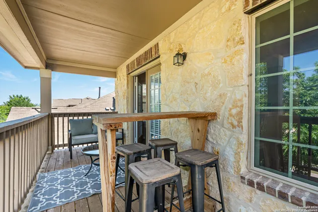 a front view of house with a garden and patio