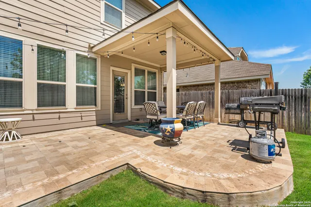 a view of a backyard with a garden and trees
