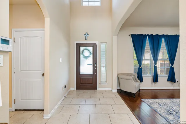 a living room with furniture rug and window