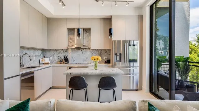 a kitchen with cabinets a sink and appliances