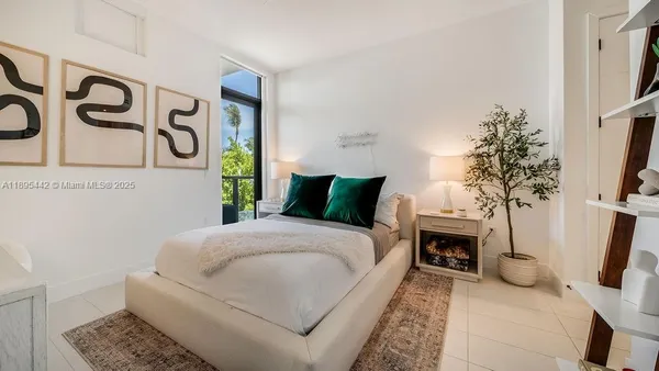 a bedroom with a bed and a couch