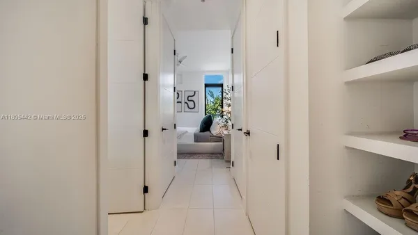a view of a bedroom from a hallway