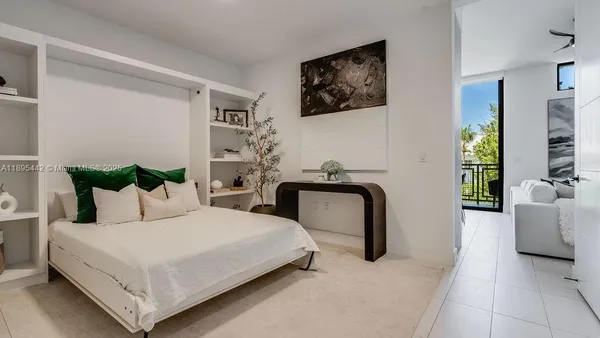 a bedroom with bed and a couch