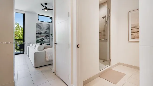 a bathroom with a granite countertop sink toilet and mirror