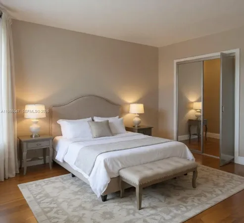 a bedroom with a bed and a table