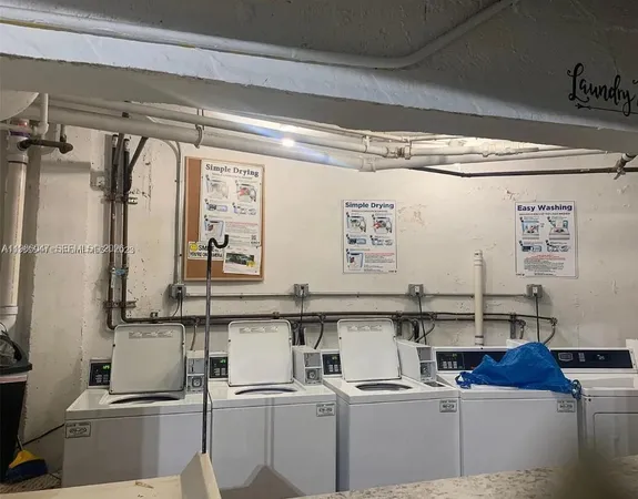 a kitchen with a refrigerator and a table