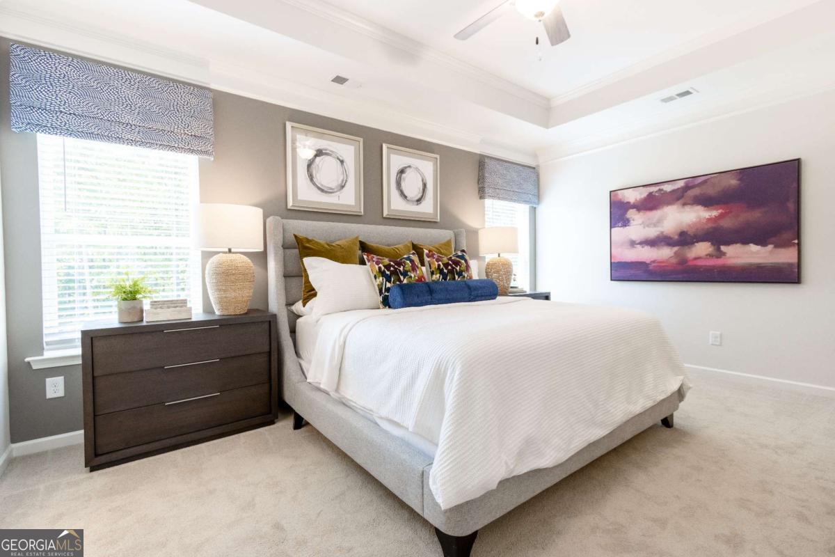 1434 Trellis Court, Unit (LOT 24) Hampton, GA 30228 - Photo 18 of 34 a bedroom with a bed and window