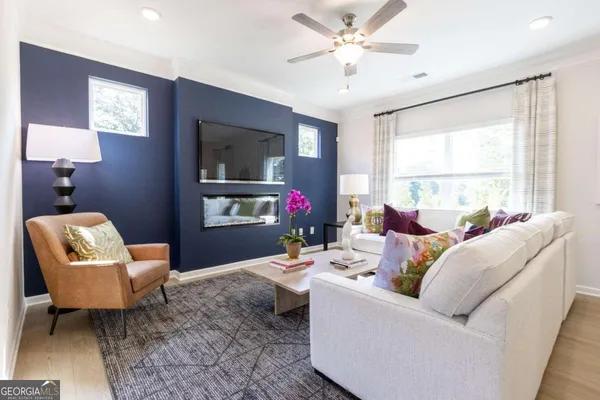 a living room with furniture and a window