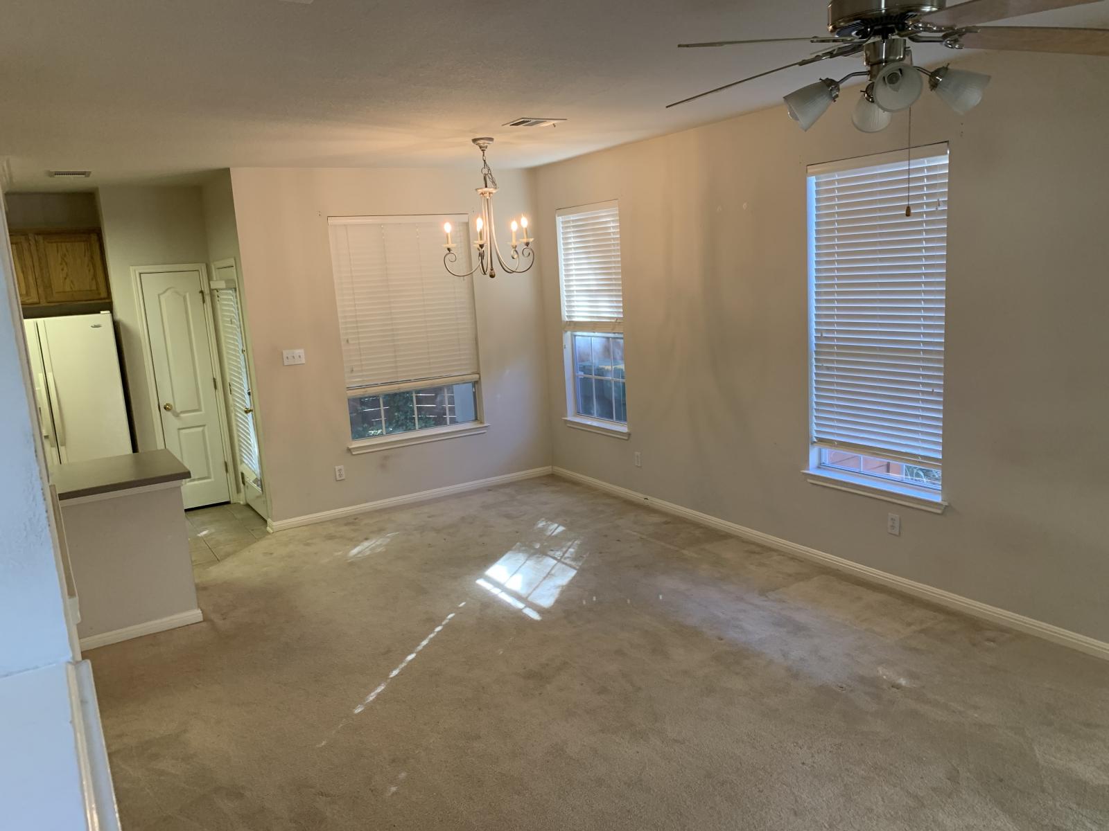 11000 Anderson Mill Road, Unit 29 Austin, TX 78750 - Photo 24 of 27 a view of a livingroom with a ceiling fan and window