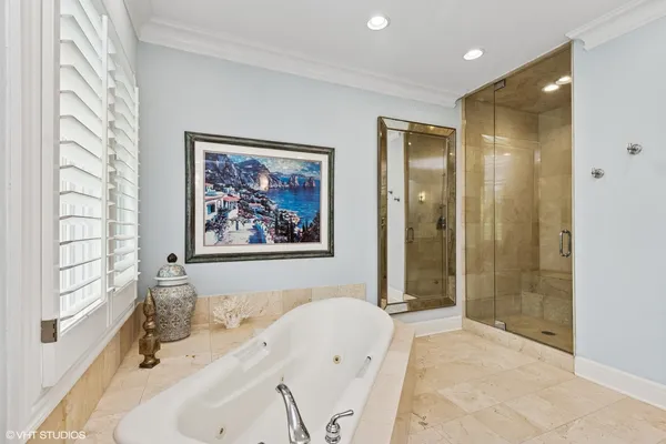 a bathroom with a sink a toilet and shower a mirror