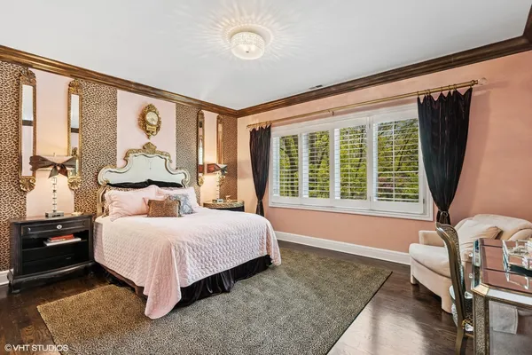 a bedroom with a large bed and a large window
