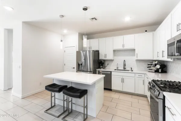 a view of dining room with furniture window and wooden floor